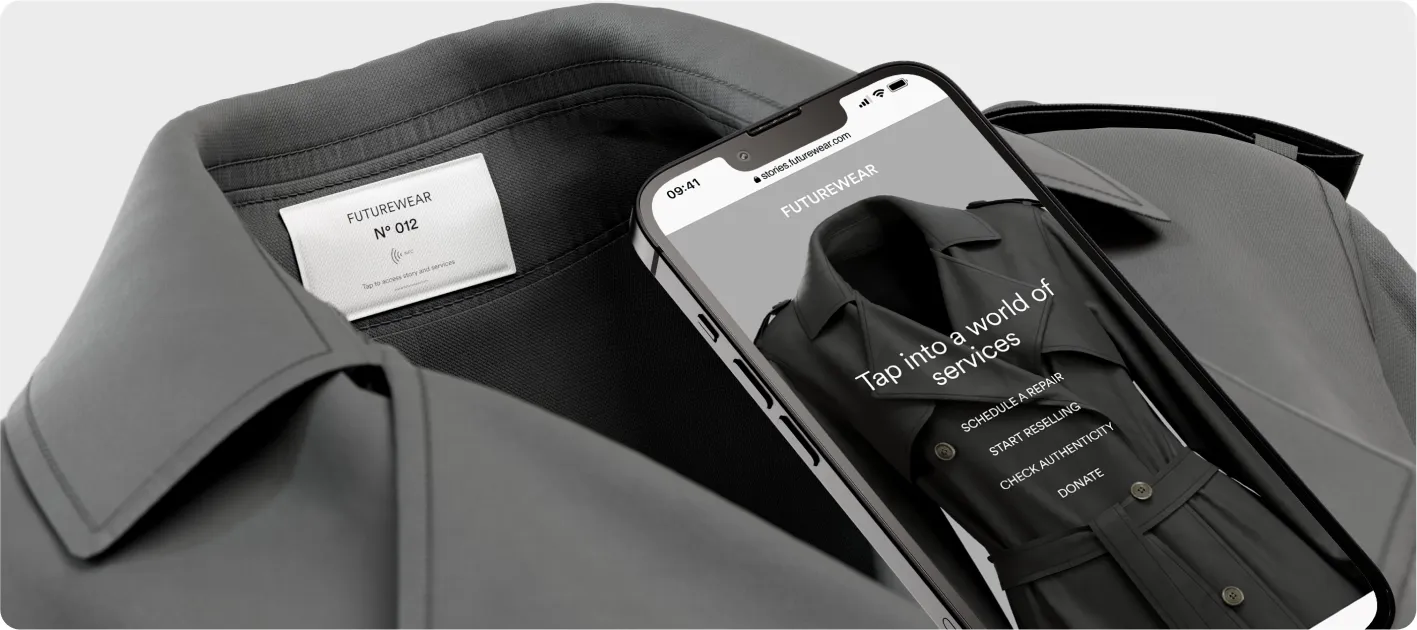 A smartphone tapping an NFC chip embedded in the label of a trench coat to activate customer services such as resale